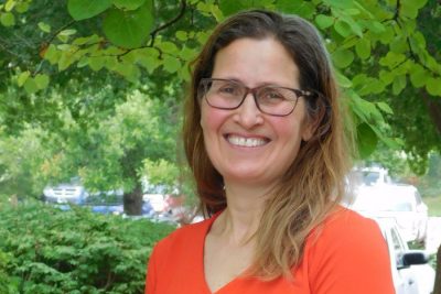 A Virginia Tech HNFE faculty member stands outside for a photo.