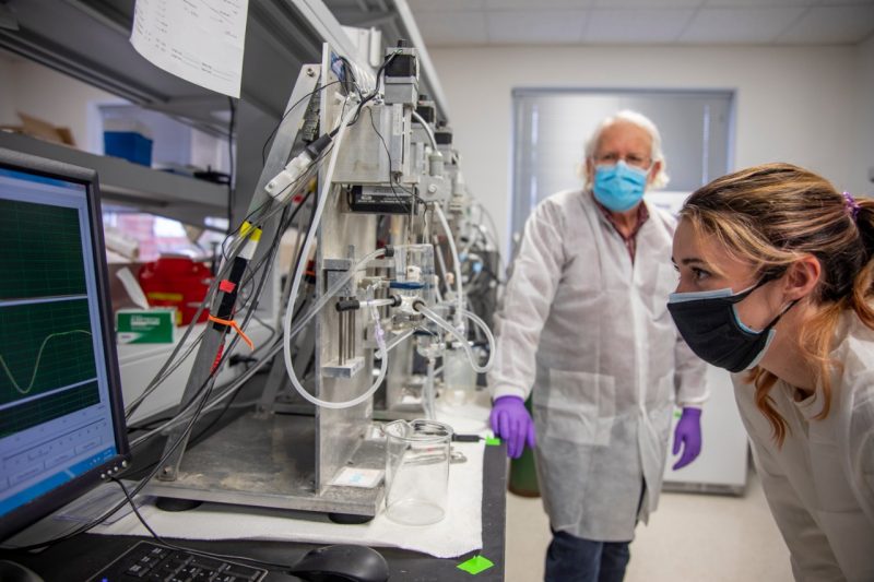 Kate Bukovec, right, analyzes data in the lab from research on Duchenne muscular dystrophy.