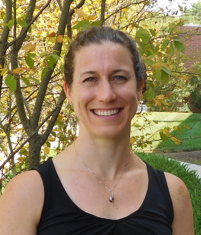 A Virginia Tech HNFE faculty member stands outside for a photo.