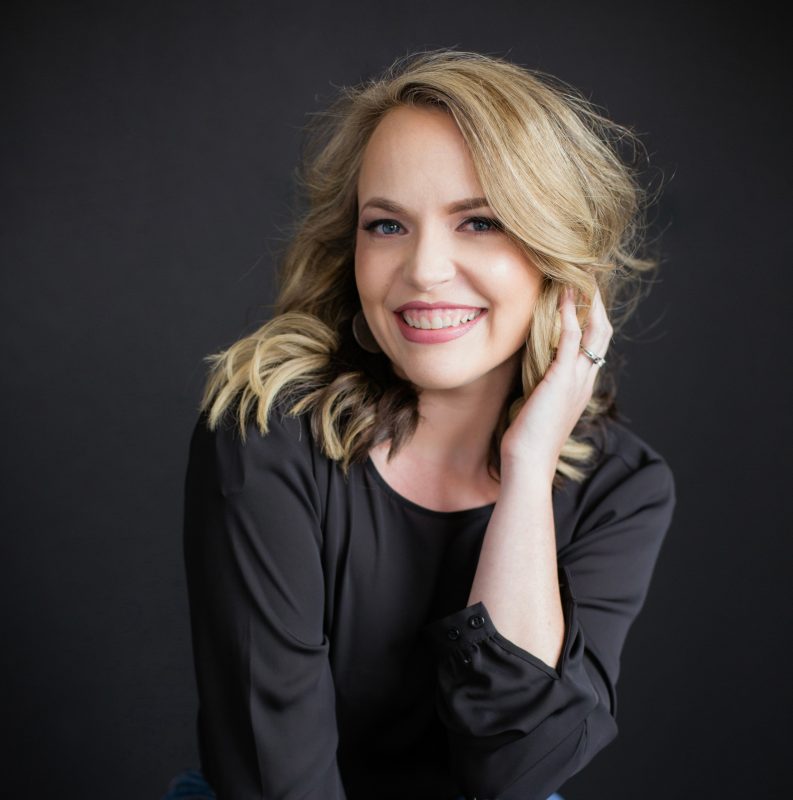 A Virginia Tech HNFE faculty member sits inside a studio for a professional headshot.