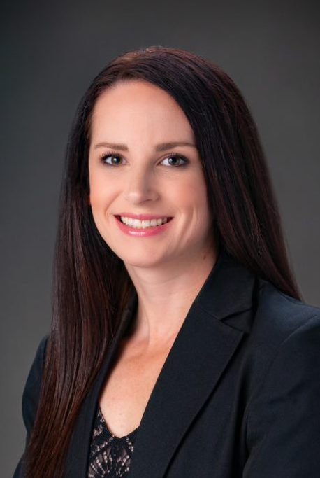 A Virginia Tech HNFE faculty member stands inside a studio for a professional headshot.