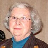 A Virginia Tech HNFE faculty member stands inside for a photo.