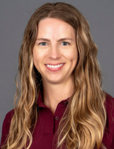 A Virginia Tech HNFE faculty member sits inside a studio for a professional headshot.